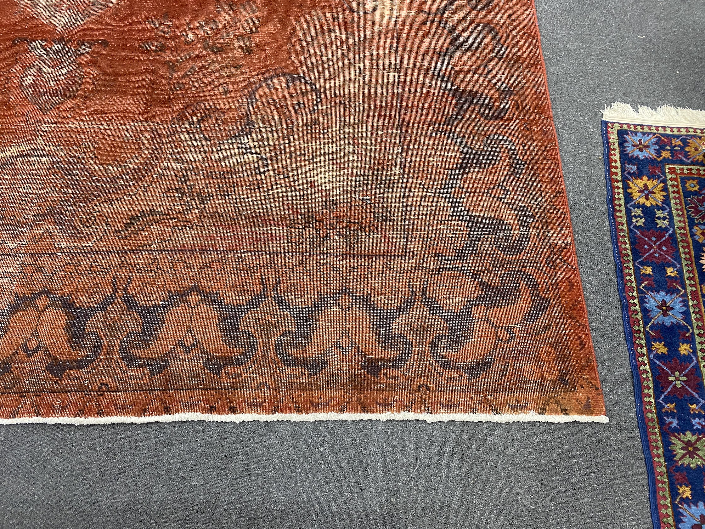 A red ground carpet, 360 x 298cm